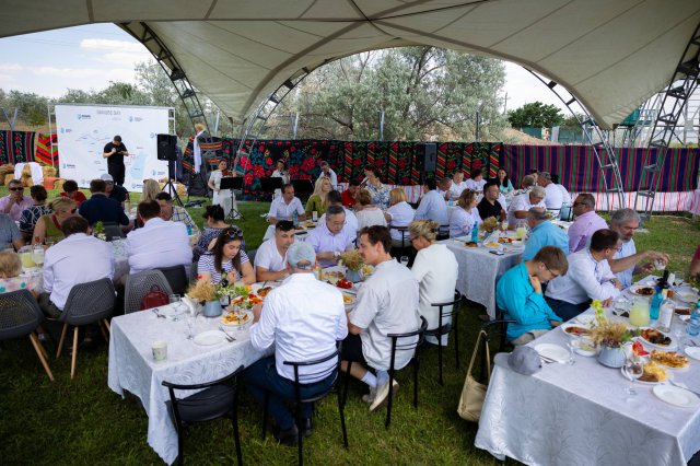 People sitting down to eat at Danube Day event